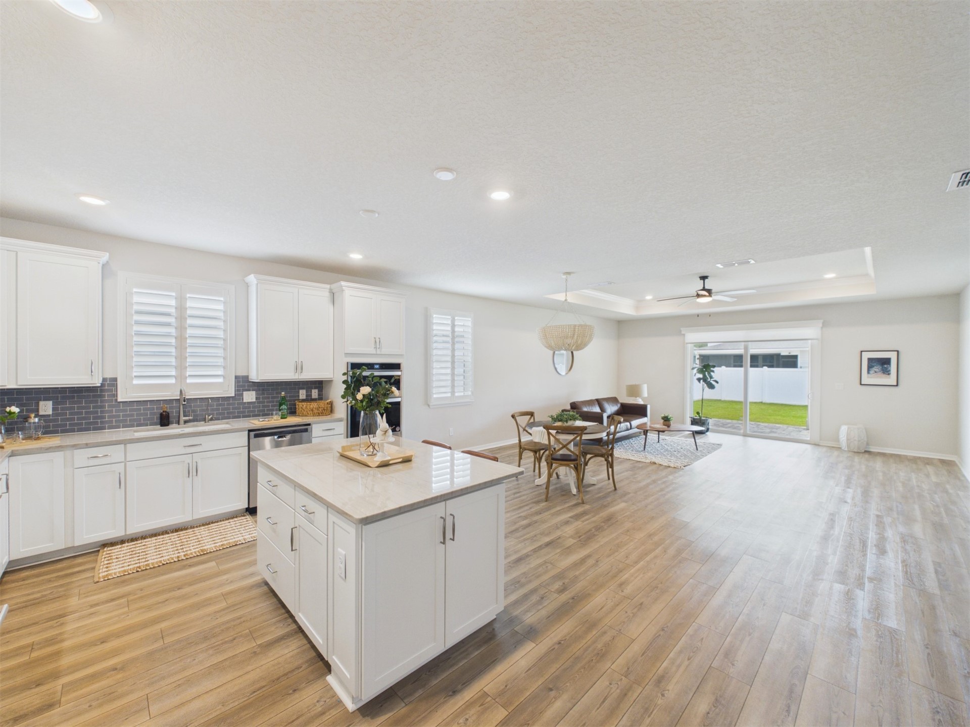 312 Salt Meadow Loop Yulee, FL 32097 - Photo 6 of 22 a kitchen with a sink and living room