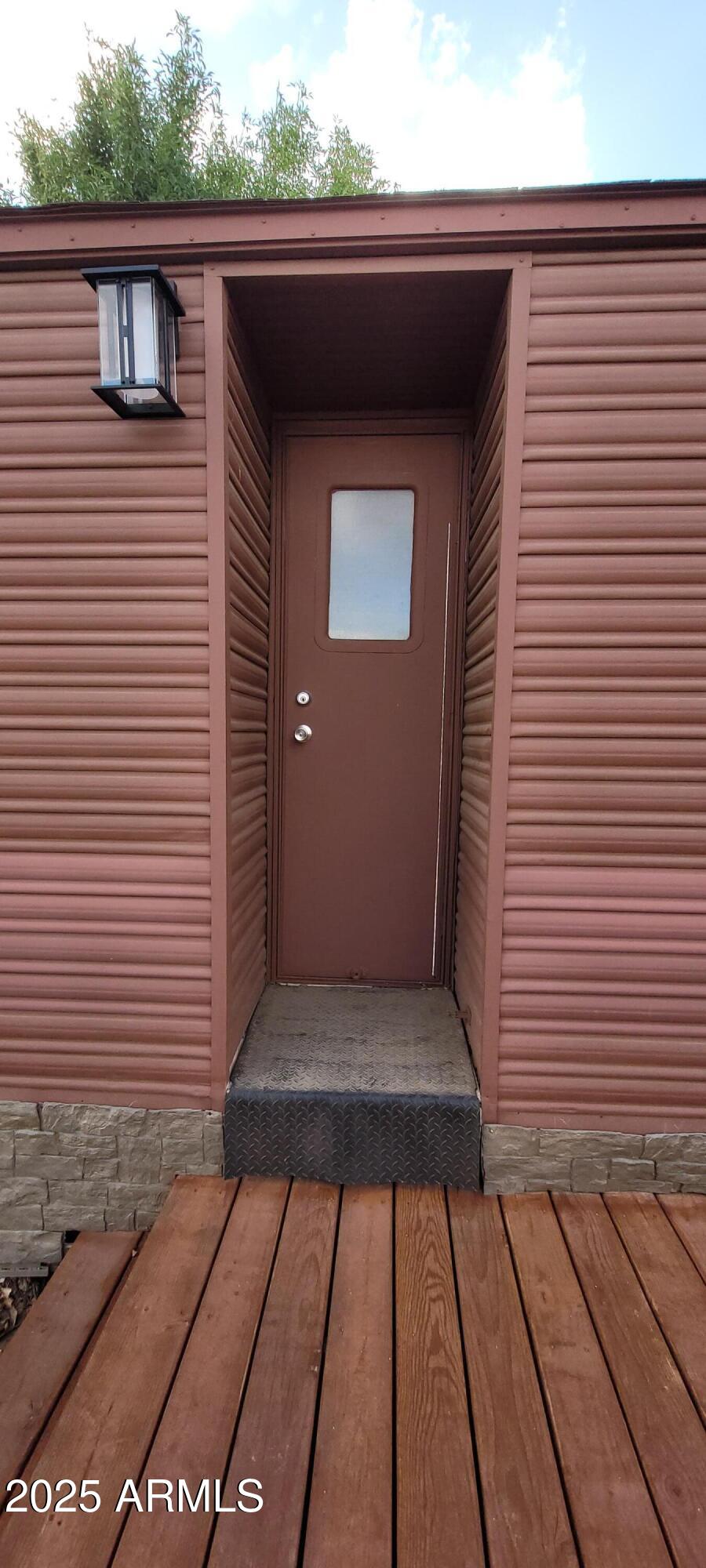 22219 West Blue Sky Drive, Unit CASITA Wittmann, AZ 85361 - Photo 12 of 15 a view of backyard with a small cabin