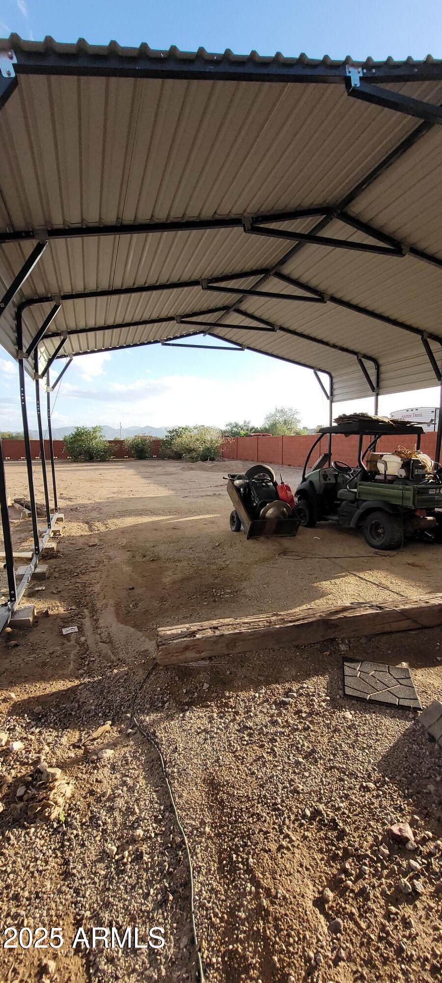 22219 West Blue Sky Drive, Unit CASITA Wittmann, AZ 85361 - Photo 13 of 15 a view of car parked