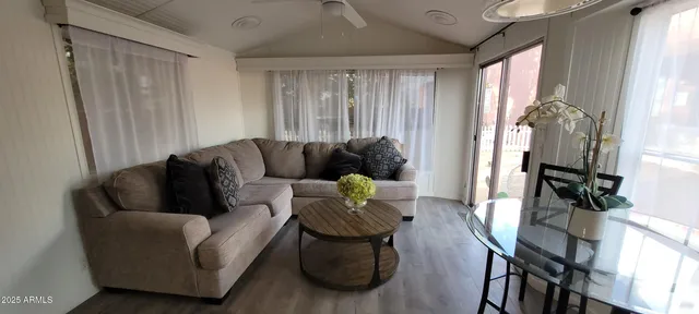 a living room with furniture and a large window