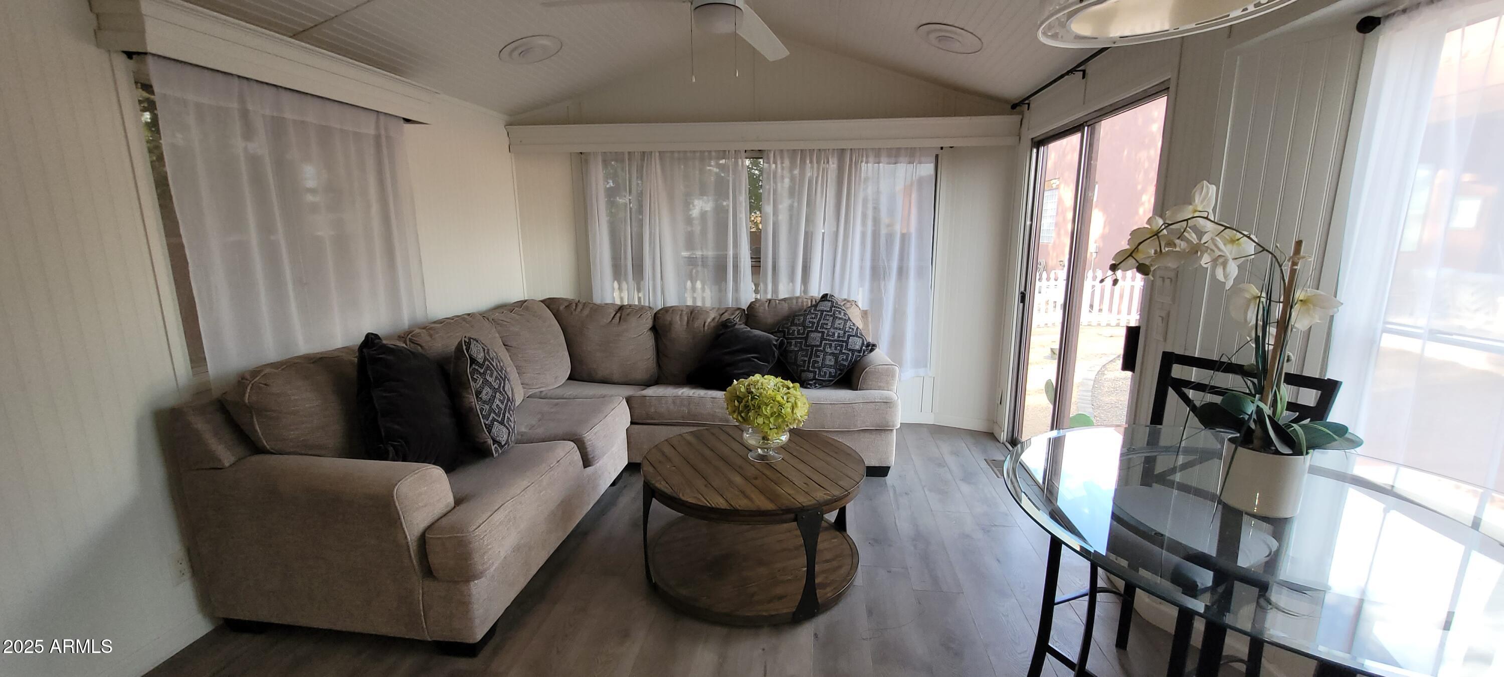 22219 West Blue Sky Drive, Unit CASITA Wittmann, AZ 85361 - Photo 4 of 15 a living room with furniture and a large window