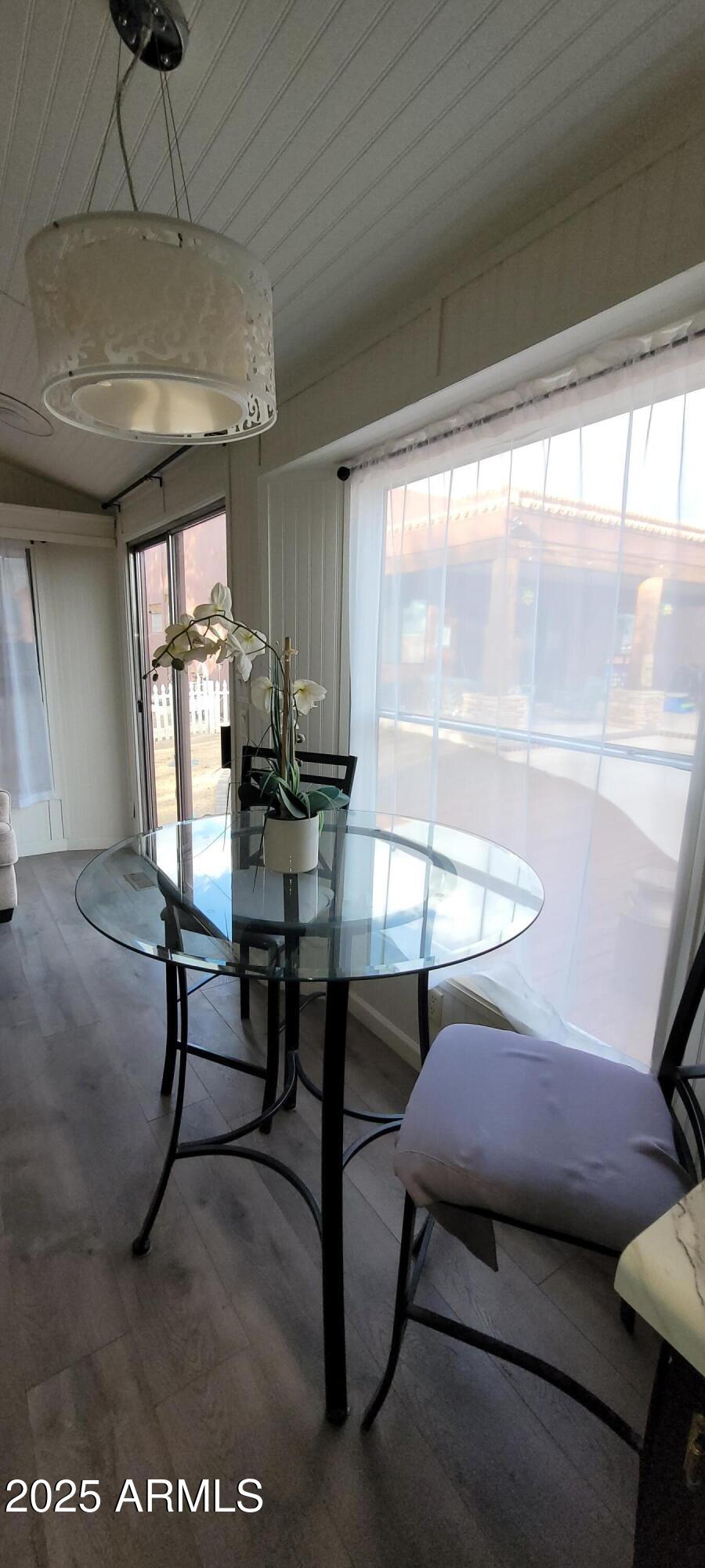 22219 West Blue Sky Drive, Unit CASITA Wittmann, AZ 85361 - Photo 5 of 15 a living room with furniture and a table