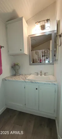 a bathroom with a toilet and shower curtain