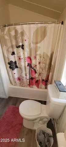 a view of a patio with a table chairs and a potted plant