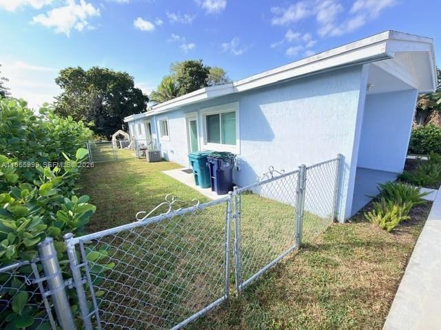 7128 Southwest 22nd Street, Unit 7128 Miami, FL 33155 - Photo 12 of 19 front view of a house with a yard