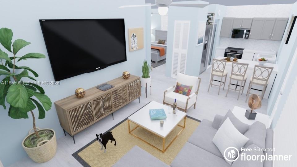 7128 Southwest 22nd Street, Unit 7128 Miami, FL 33155 - Photo 15 of 19 a living room with furniture and a flat screen tv