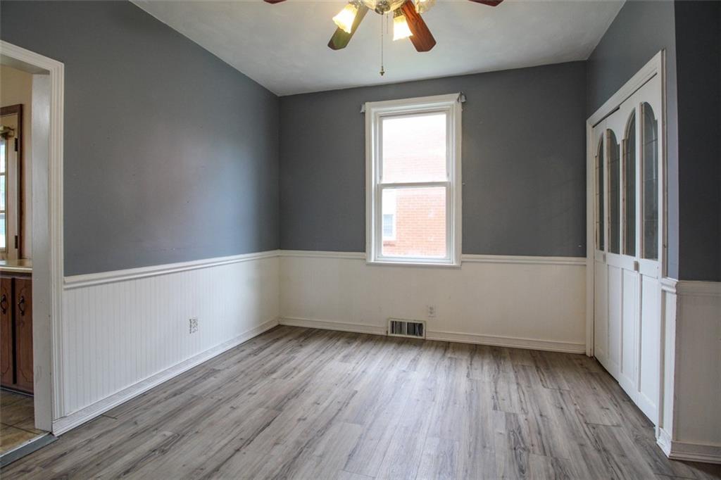 202 Jane Street McKees Rocks, PA 15136 - Photo 13 of 44 an empty room with wooden floor and windows