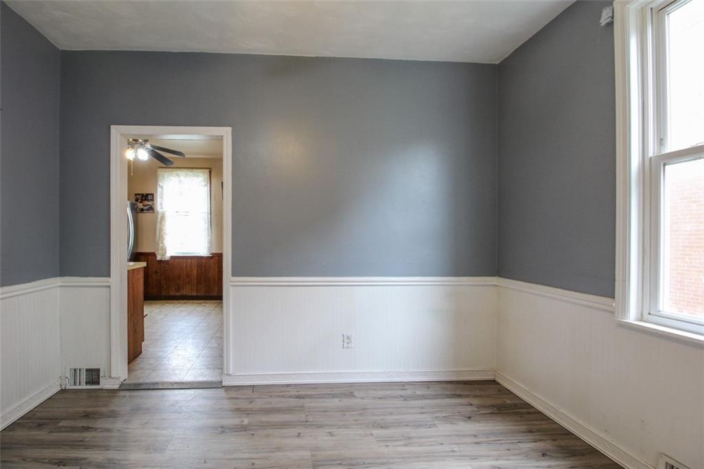 202 Jane Street McKees Rocks, PA 15136 - Photo 16 of 44 a view of empty room with wooden floor and fan