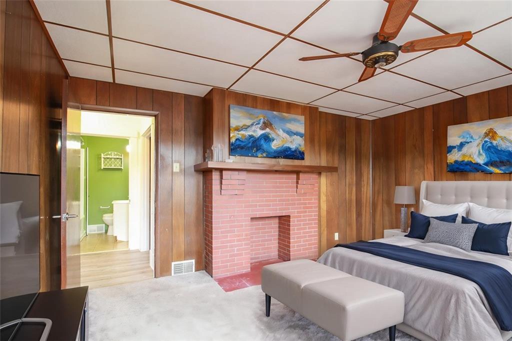 202 Jane Street McKees Rocks, PA 15136 - Photo 27 of 44 a bedroom with a bed and a painting on the wall