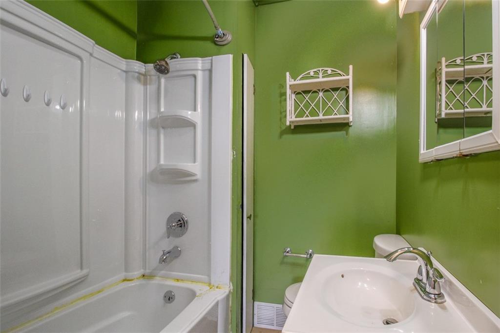 202 Jane Street McKees Rocks, PA 15136 - Photo 35 of 44 a bathroom with a sink a toilet and shower