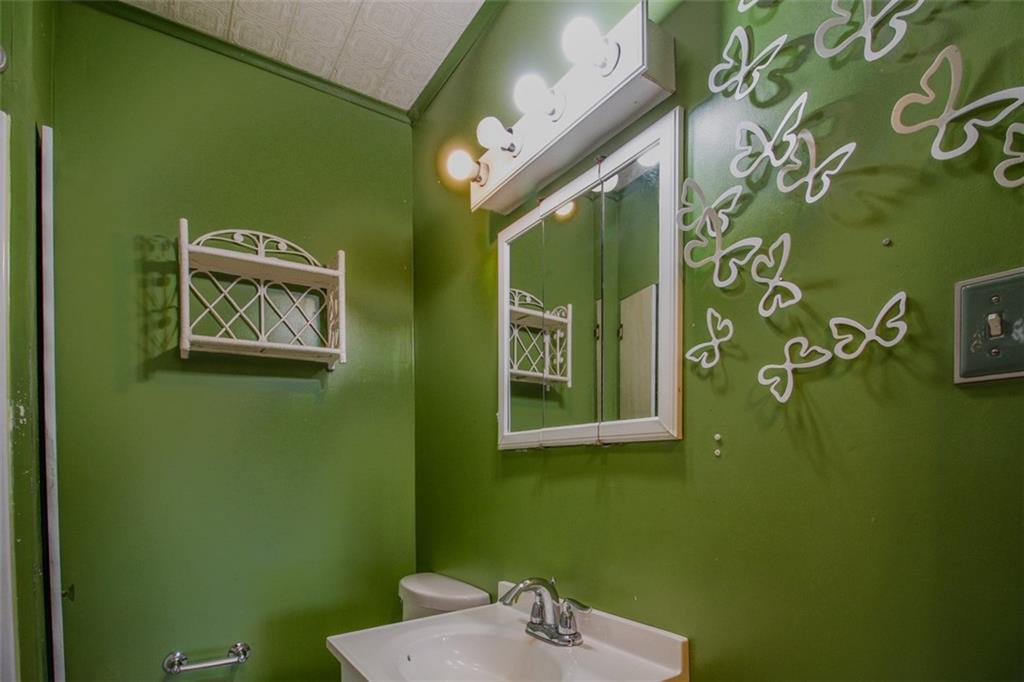 202 Jane Street McKees Rocks, PA 15136 - Photo 36 of 44 a bathroom with a sink and a mirror