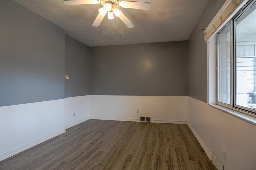202 Jane Street McKees Rocks, PA 15136 - Photo 7 of 44 wooden floor in an empty room with a window