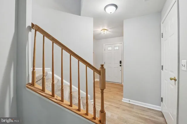 a view of staircase with rug