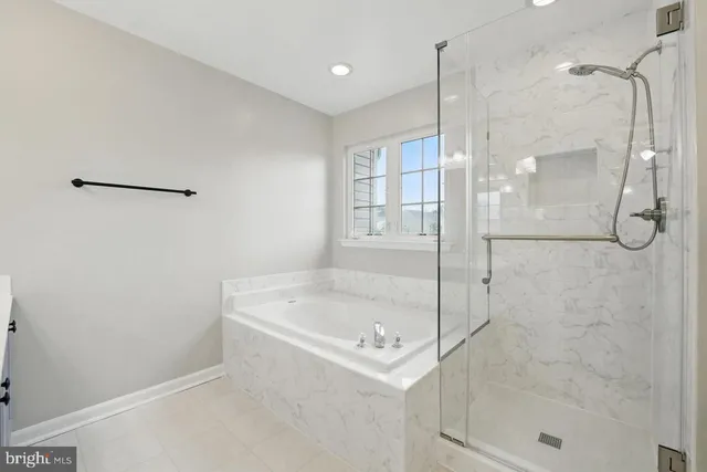 a bathroom with a shower and a bathtub