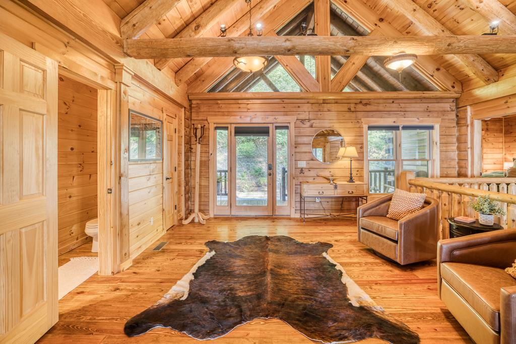 1447 Grandeur Drive Blue Ridge, GA 30513 - Photo 11 of 60 a living room with furniture and a large window