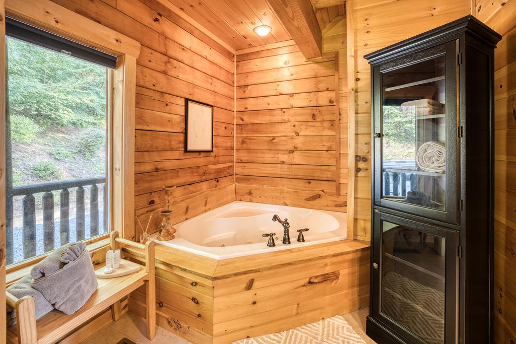 1447 Grandeur Drive Blue Ridge, GA 30513 - Photo 23 of 60 a bathroom with a bathtub and shower
