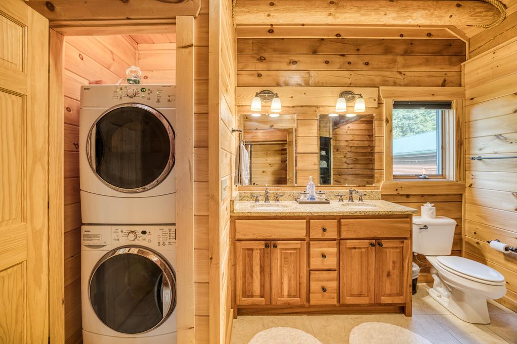 1447 Grandeur Drive Blue Ridge, GA 30513 - Photo 24 of 60 a view of a bathroom with a washer and dryer