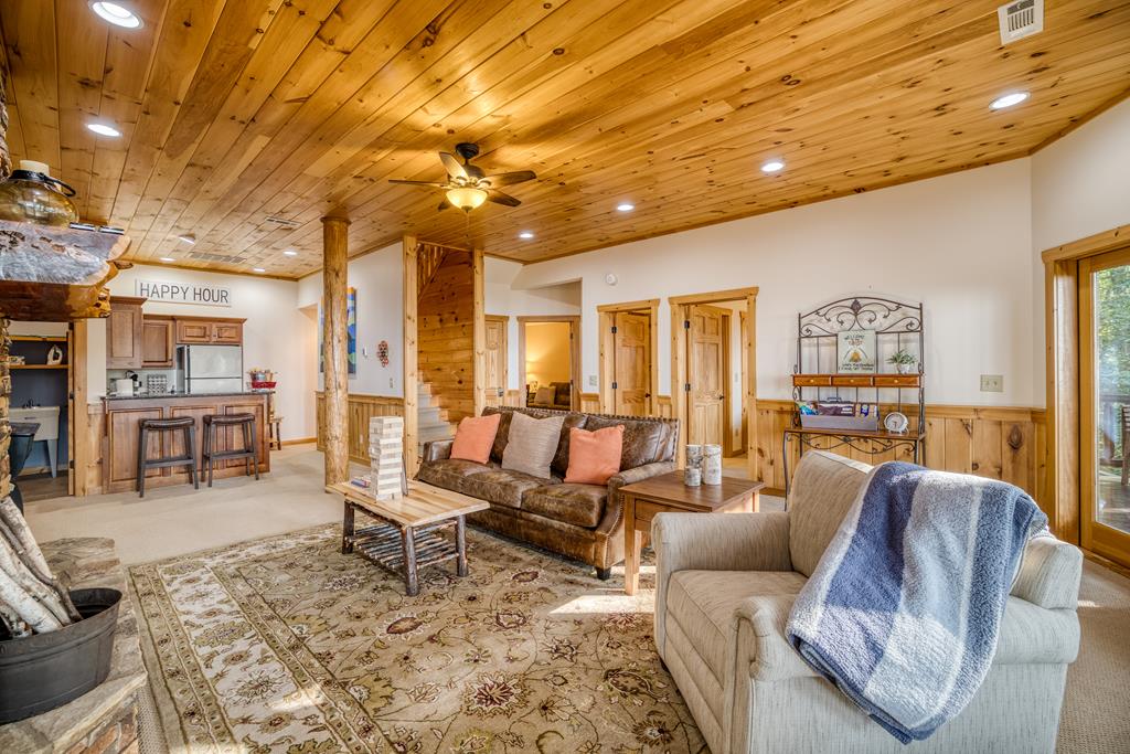 1447 Grandeur Drive Blue Ridge, GA 30513 - Photo 33 of 60 a living room with furniture and a large window