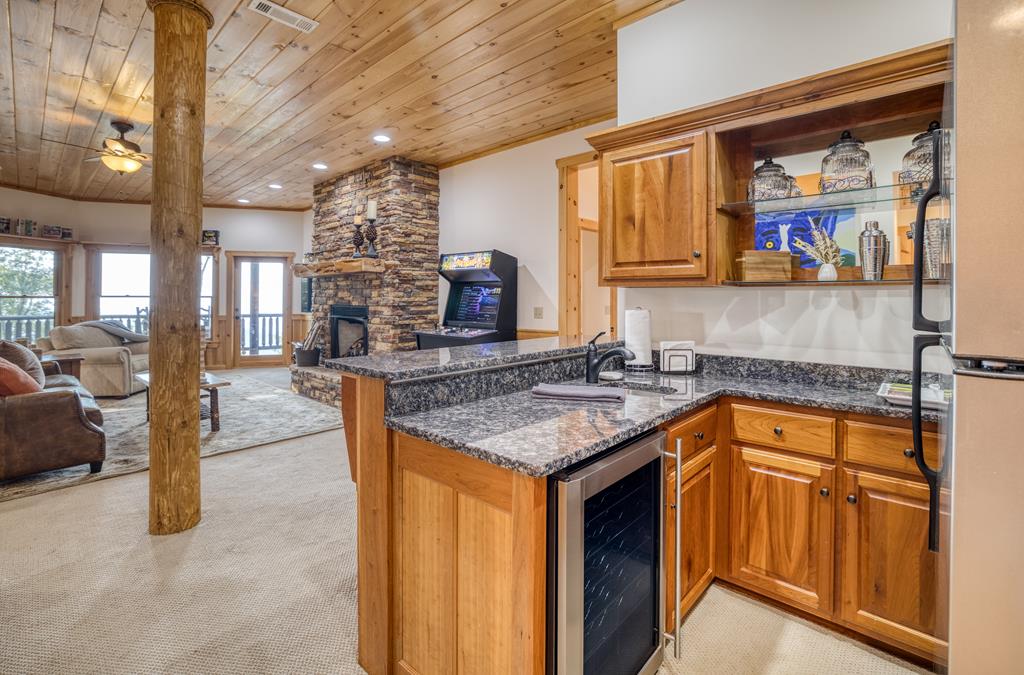 1447 Grandeur Drive Blue Ridge, GA 30513 - Photo 37 of 60 a kitchen with stainless steel appliances granite countertop a sink stove and cabinets