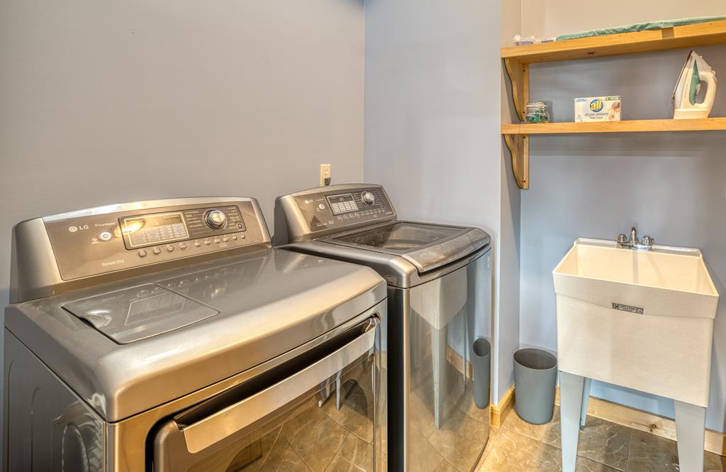 1447 Grandeur Drive Blue Ridge, GA 30513 - Photo 38 of 60 a utility room with dryer and washer