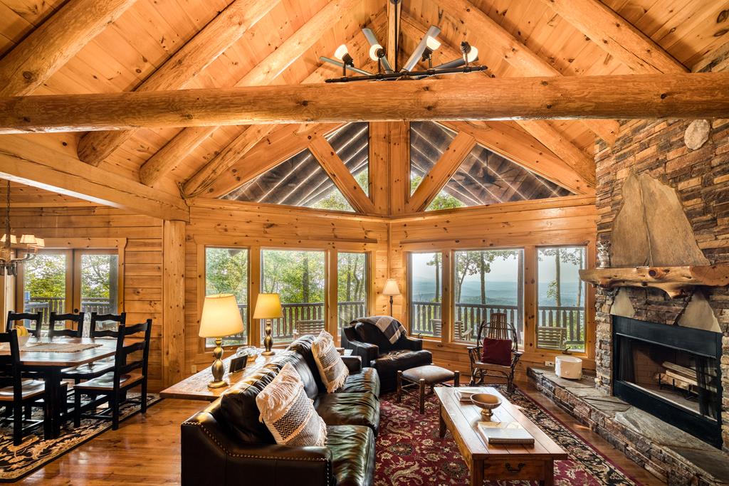 1447 Grandeur Drive Blue Ridge, GA 30513 - Photo 9 of 60 a living room with furniture a fireplace and city view