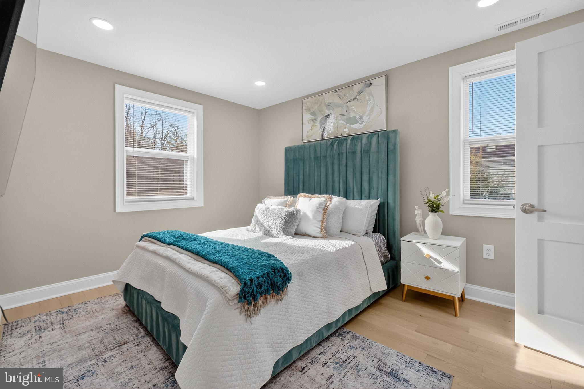 3151 Newton Street Northeast Washington, DC 20018 - Photo 19 of 49 a bedroom with a large bed and a window