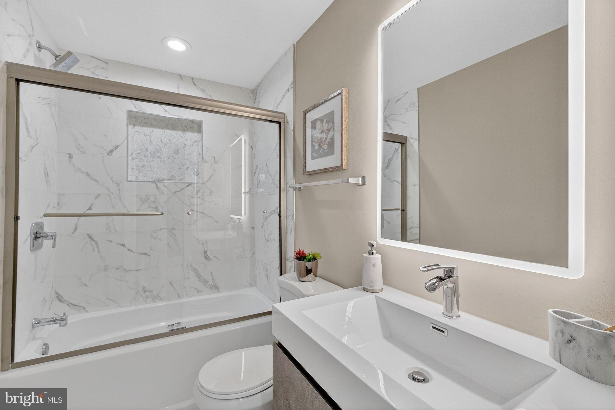 3151 Newton Street Northeast Washington, DC 20018 - Photo 23 of 49 a bathroom with a sink toilet and shower