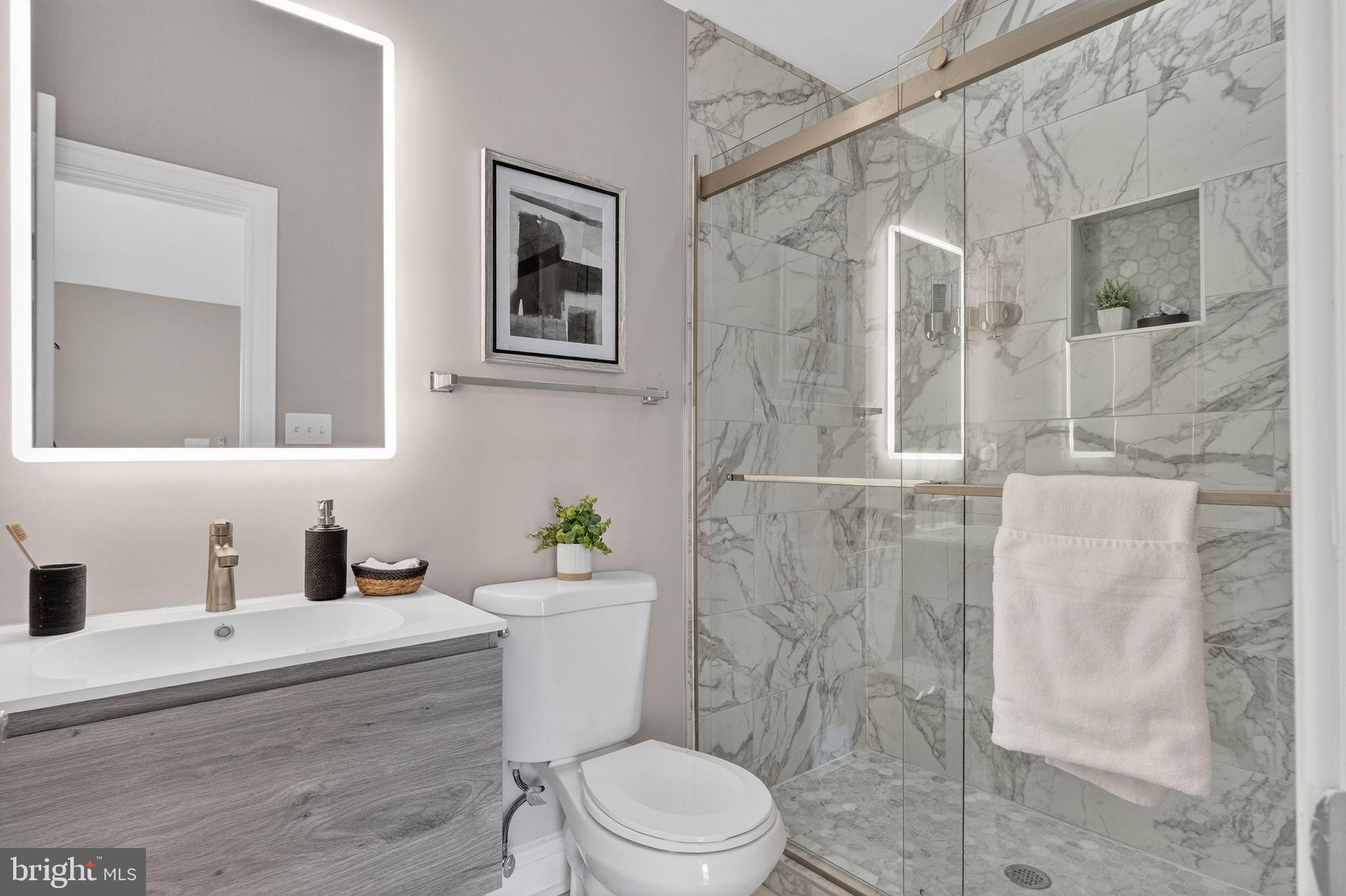 3151 Newton Street Northeast Washington, DC 20018 - Photo 28 of 49 a bathroom with a sink toilet and shower