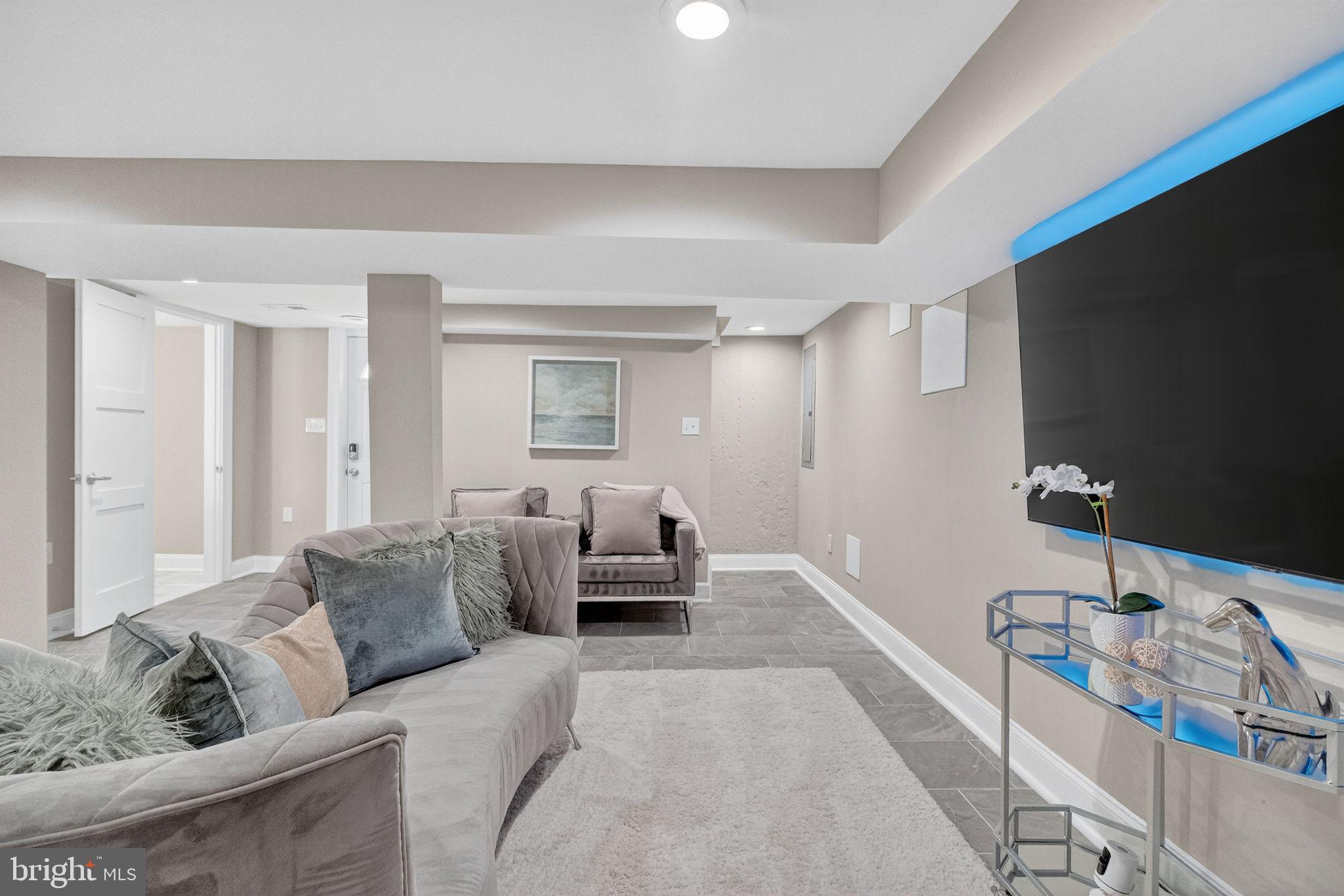 3151 Newton Street Northeast Washington, DC 20018 - Photo 31 of 49 a living room with furniture and a flat screen tv