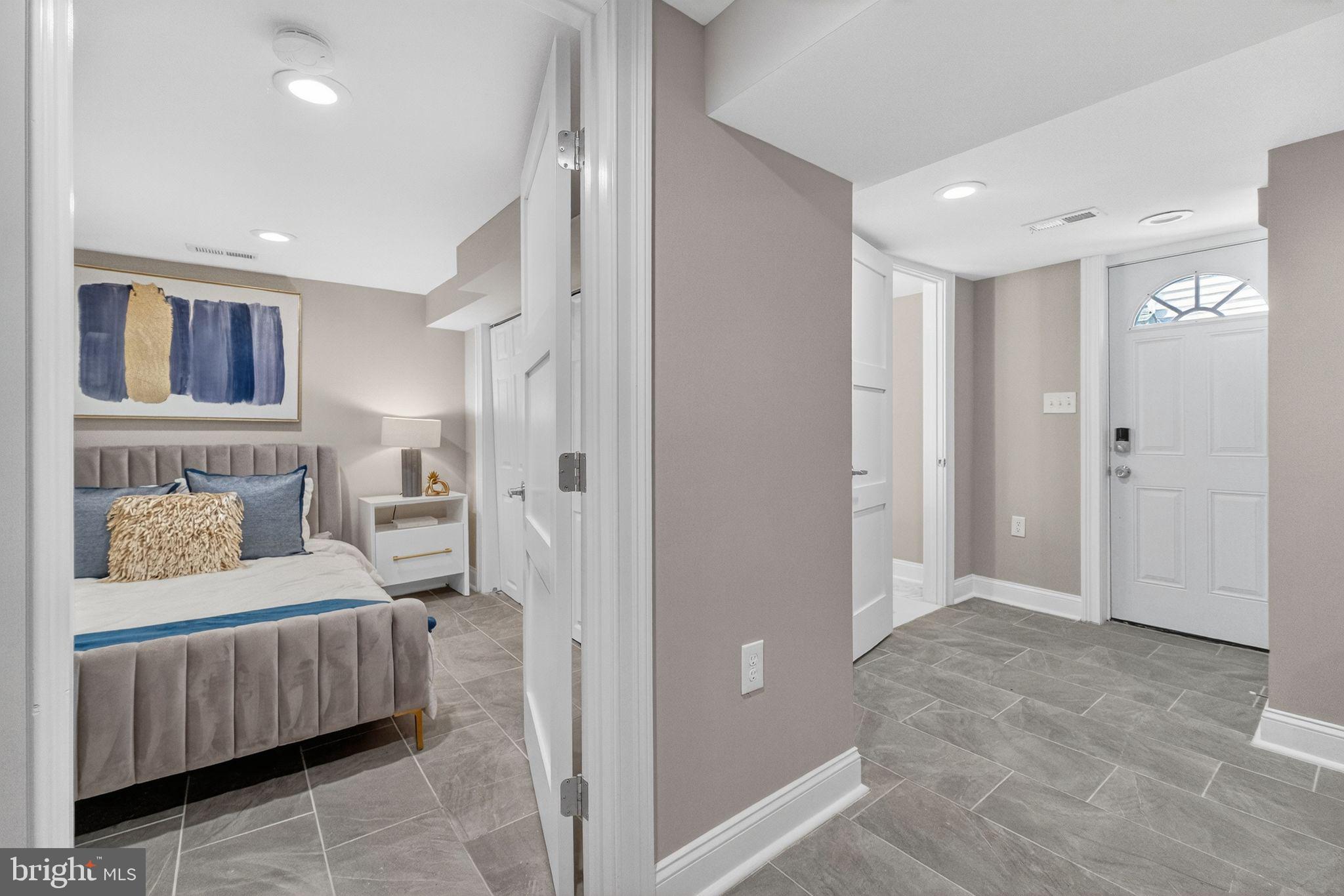 3151 Newton Street Northeast Washington, DC 20018 - Photo 32 of 49 a bedroom with a bed and furniture