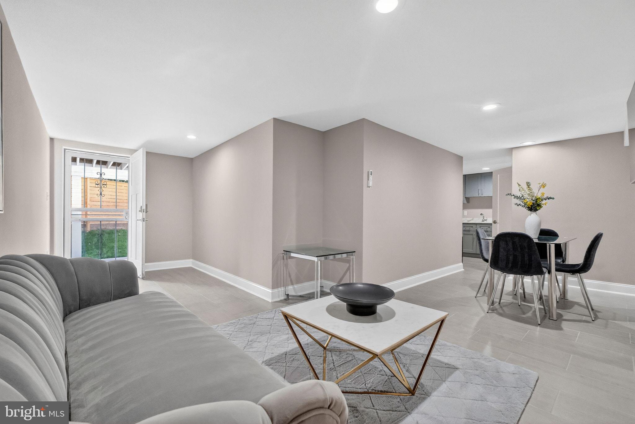 3151 Newton Street Northeast Washington, DC 20018 - Photo 40 of 49 a living room with furniture and a large window