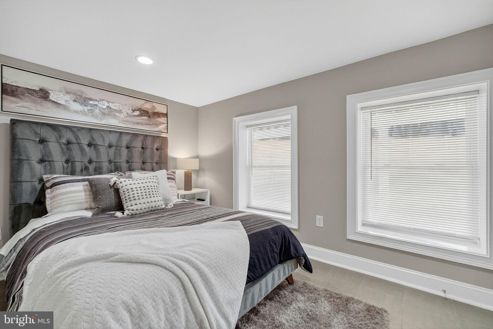 3151 Newton Street Northeast Washington, DC 20018 - Photo 43 of 49 a bedroom with a large bed and a window
