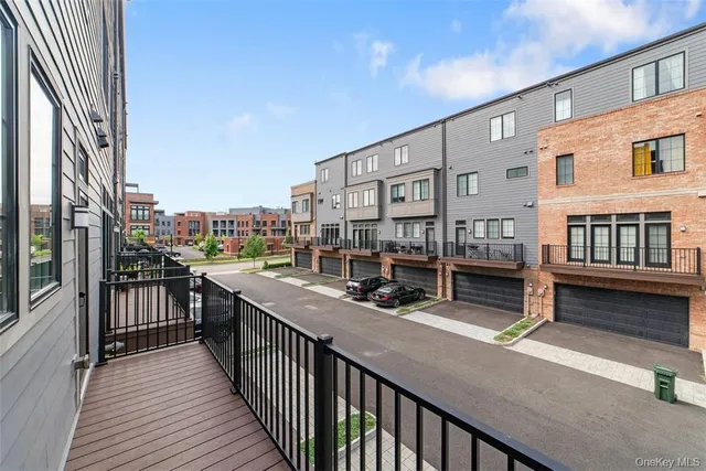 a view of a balcony with chairs