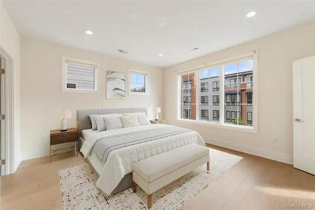 a spacious bedroom with a large bed and a window