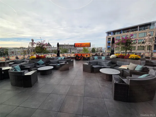 a living room with furniture and large windows