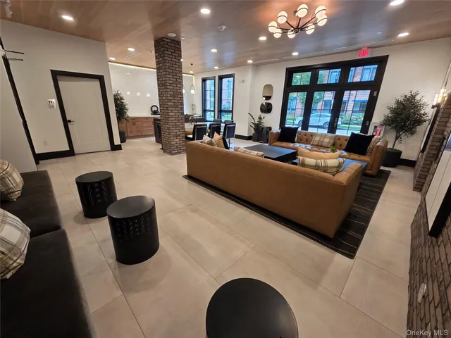 a view of a large building in front of a bunch of flowers