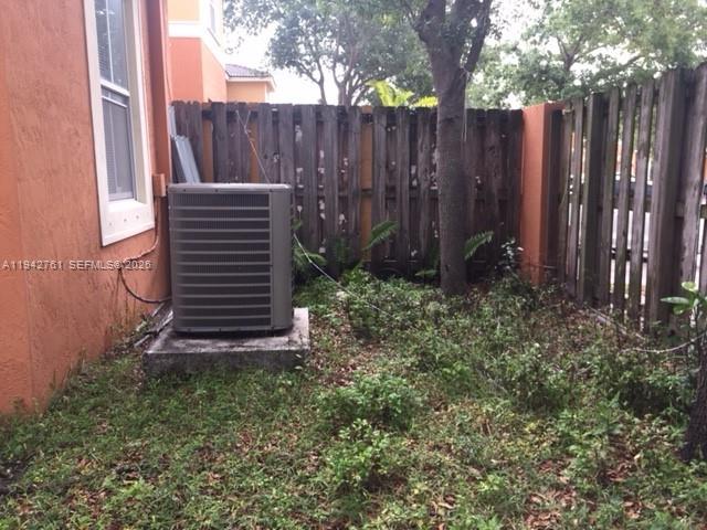 10852 Southwest 240th Street Homestead, FL 33032 - Photo 12 of 15 a view of outdoor space with wooden fence
