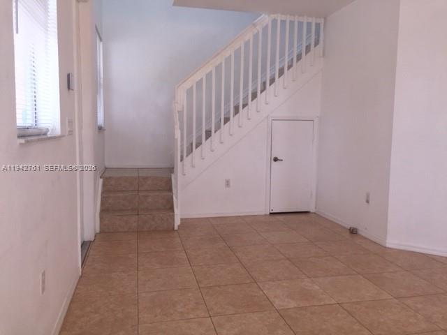 10852 Southwest 240th Street Homestead, FL 33032 - Photo 6 of 15 a view of an entryway with staircase