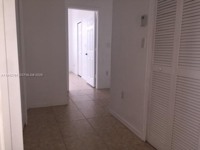 10852 Southwest 240th Street Homestead, FL 33032 - Photo 9 of 15 a view of hallway with a bathroom