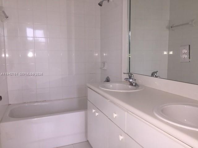10852 Southwest 240th Street Homestead, FL 33032 - Photo 10 of 15 a bathroom with a bathtub and a sink
