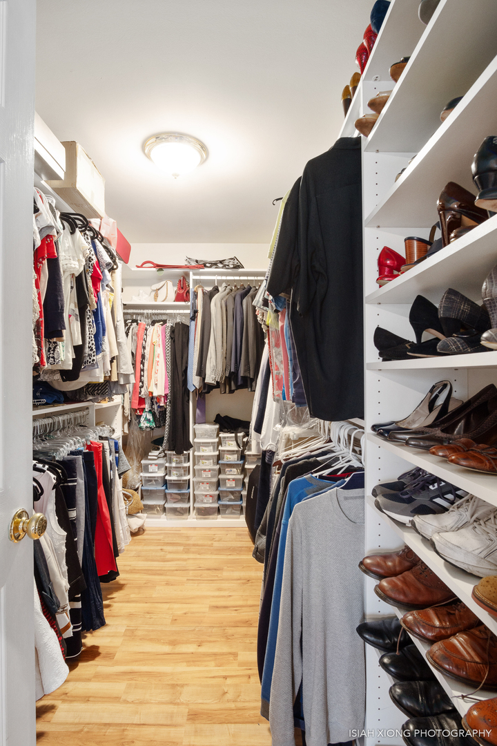 26W407 Jewell Road Winfield, IL 60190 - Photo 14 of 30 a view of walk in closet with clothes and shoes