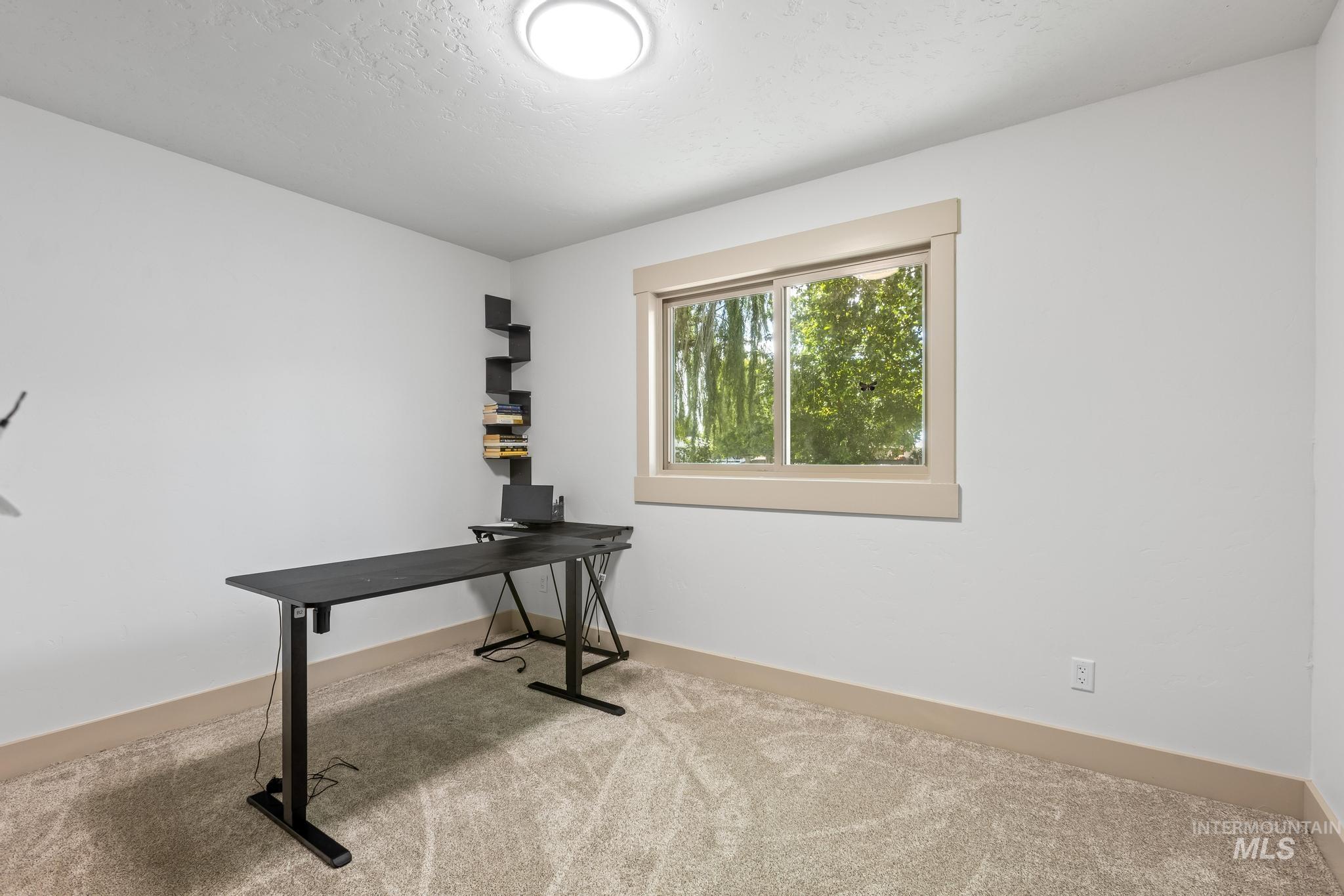 8500 Washoe Road Payette, ID 83661 - Photo 39 of 50 Carpeted office featuring baseboards and a textured ceiling