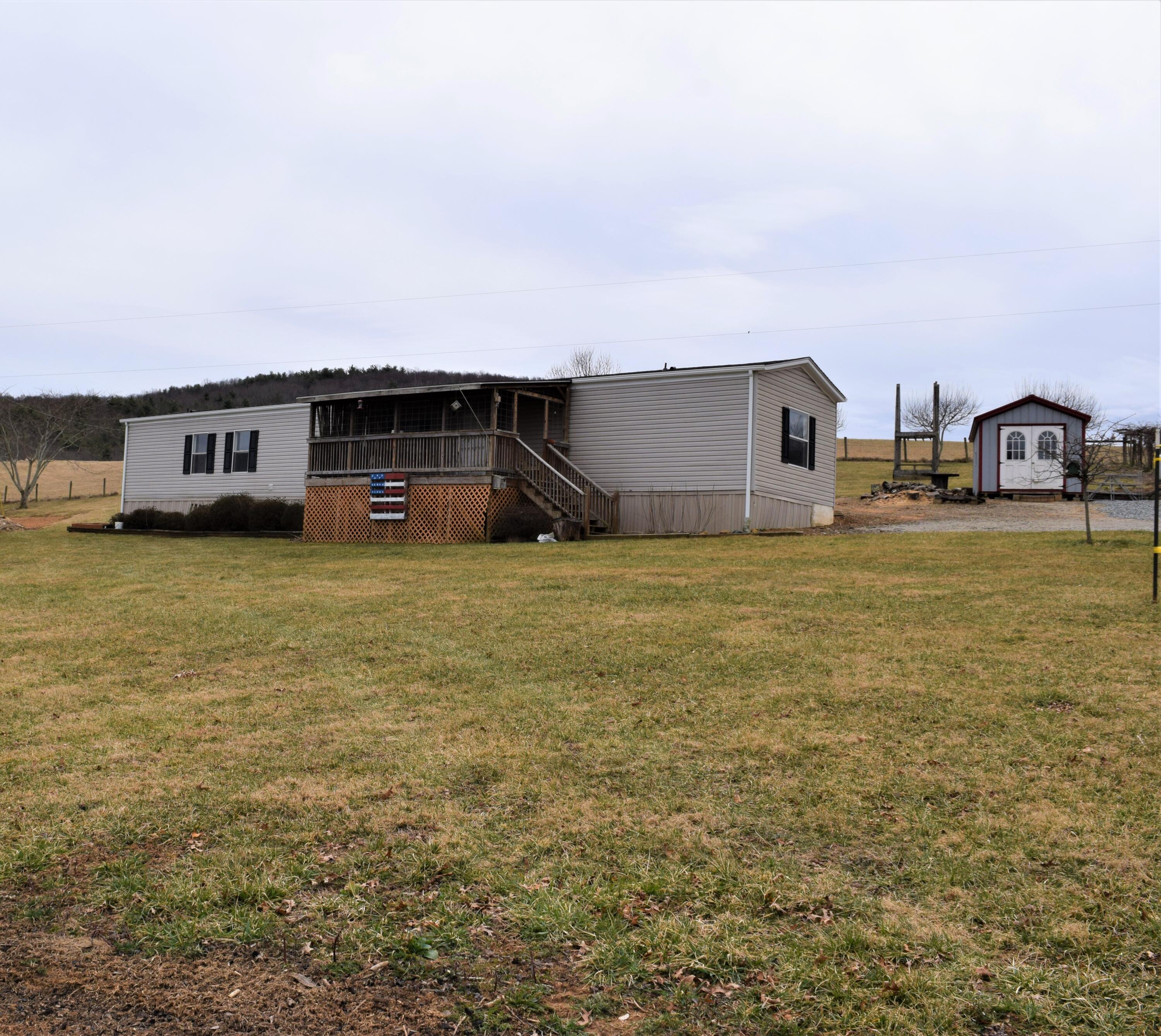 144 Weeks Road Northwest Floyd, VA 24091 - Photo 1 of 19 a view of a house with a yard