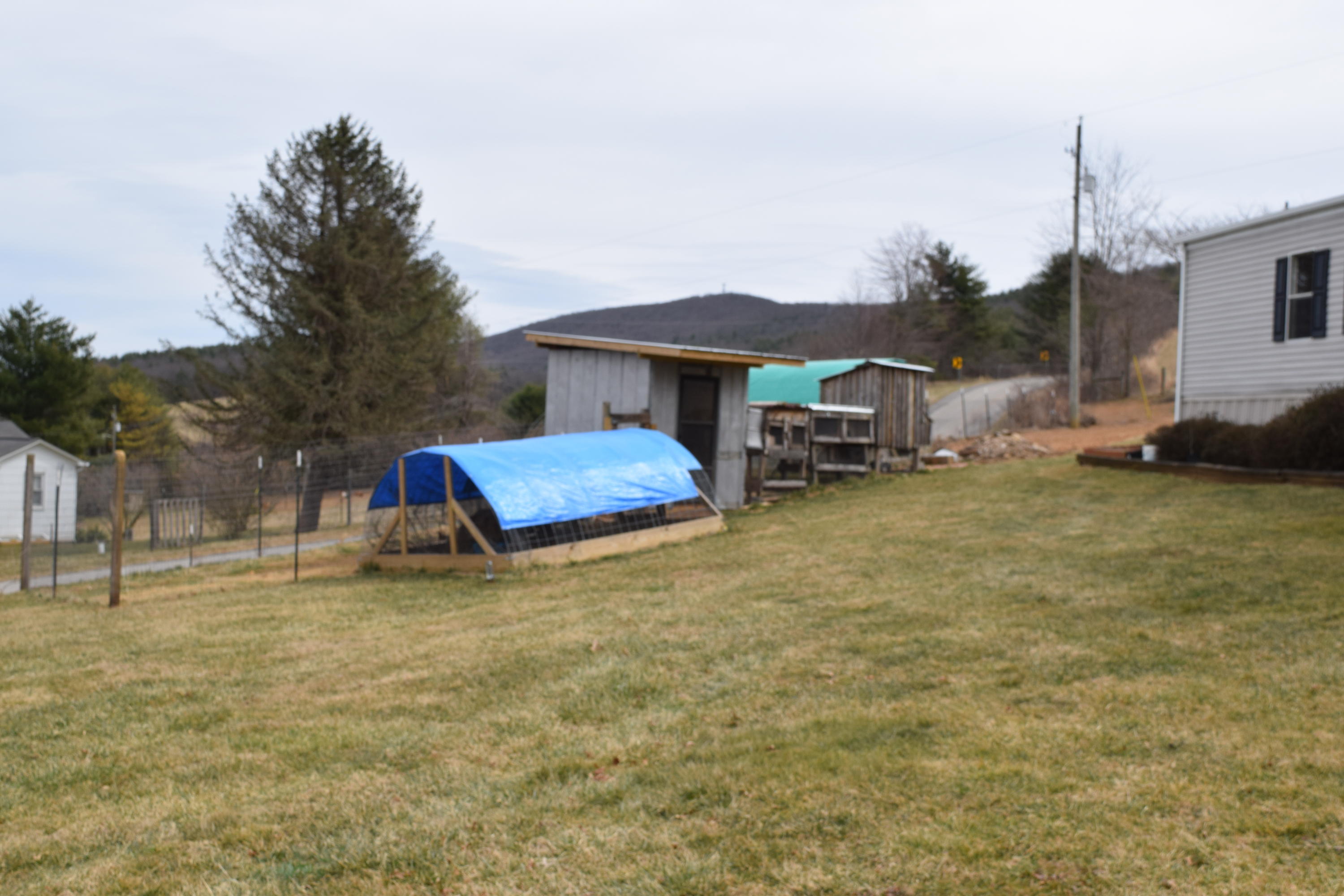 144 Weeks Road Northwest Floyd, VA 24091 - Photo 2 of 19 a backyard of a house with barbeque oven and outdoor seating