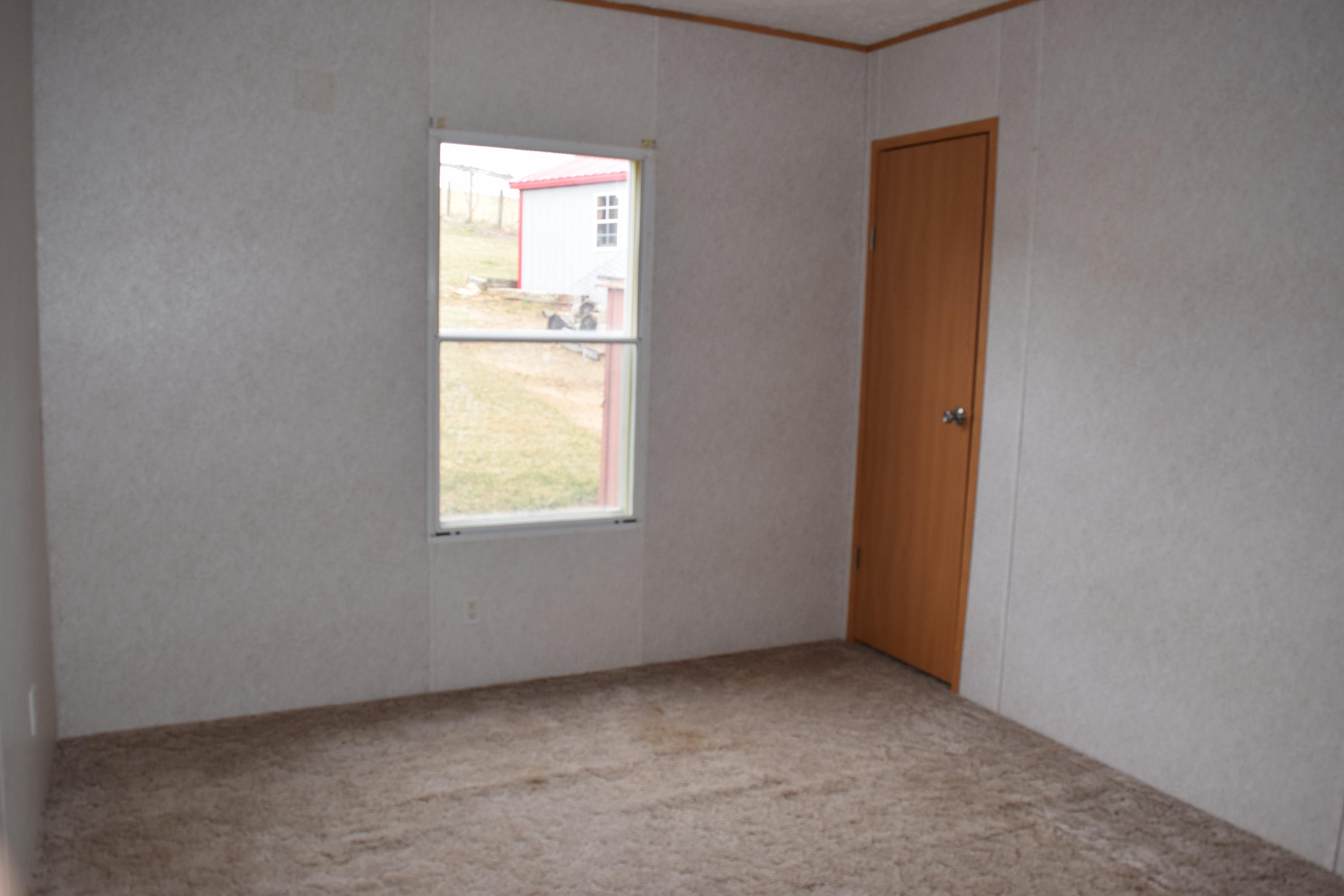 144 Weeks Road Northwest Floyd, VA 24091 - Photo 14 of 19 an empty room with a window
