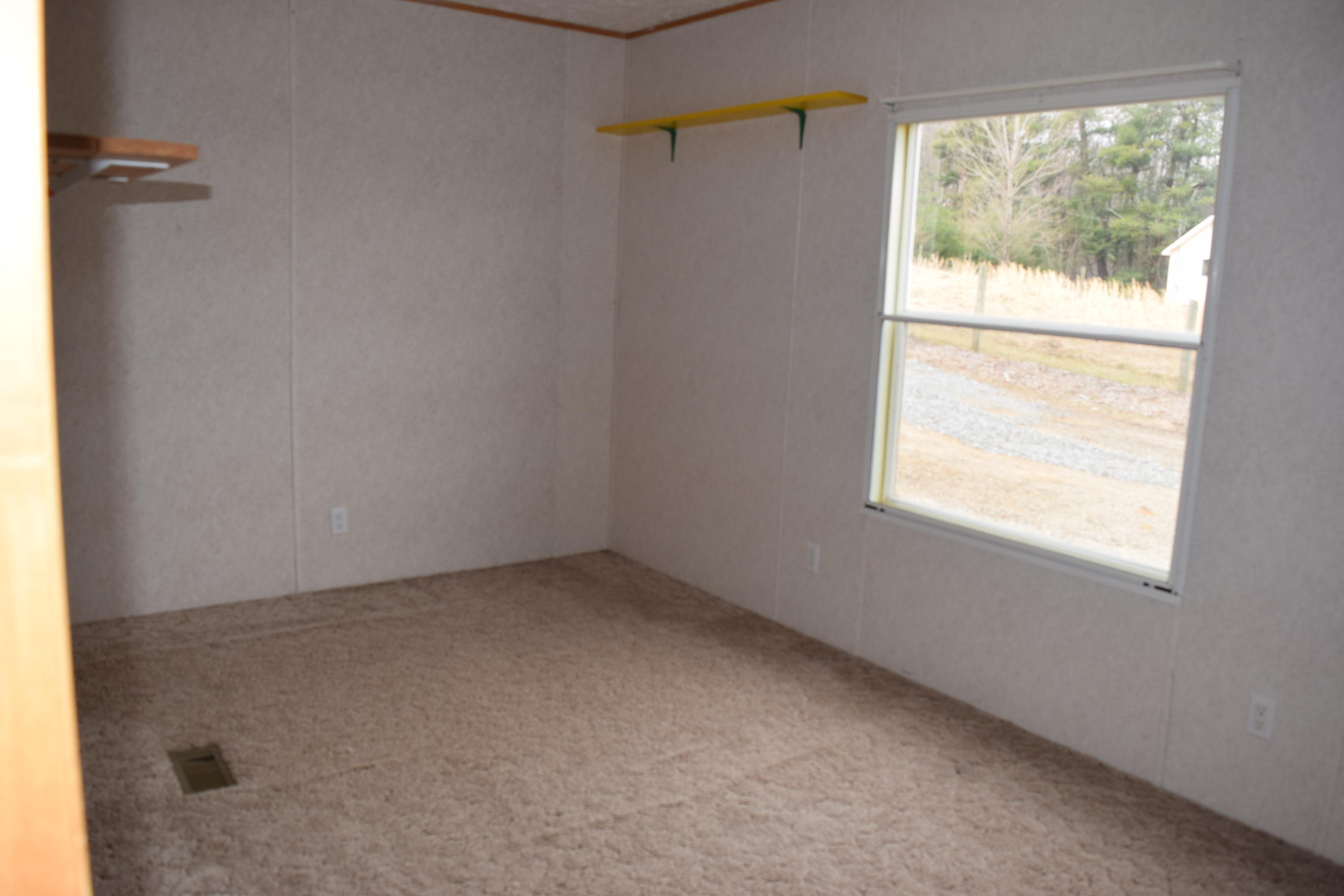 144 Weeks Road Northwest Floyd, VA 24091 - Photo 15 of 19 an empty room with a window