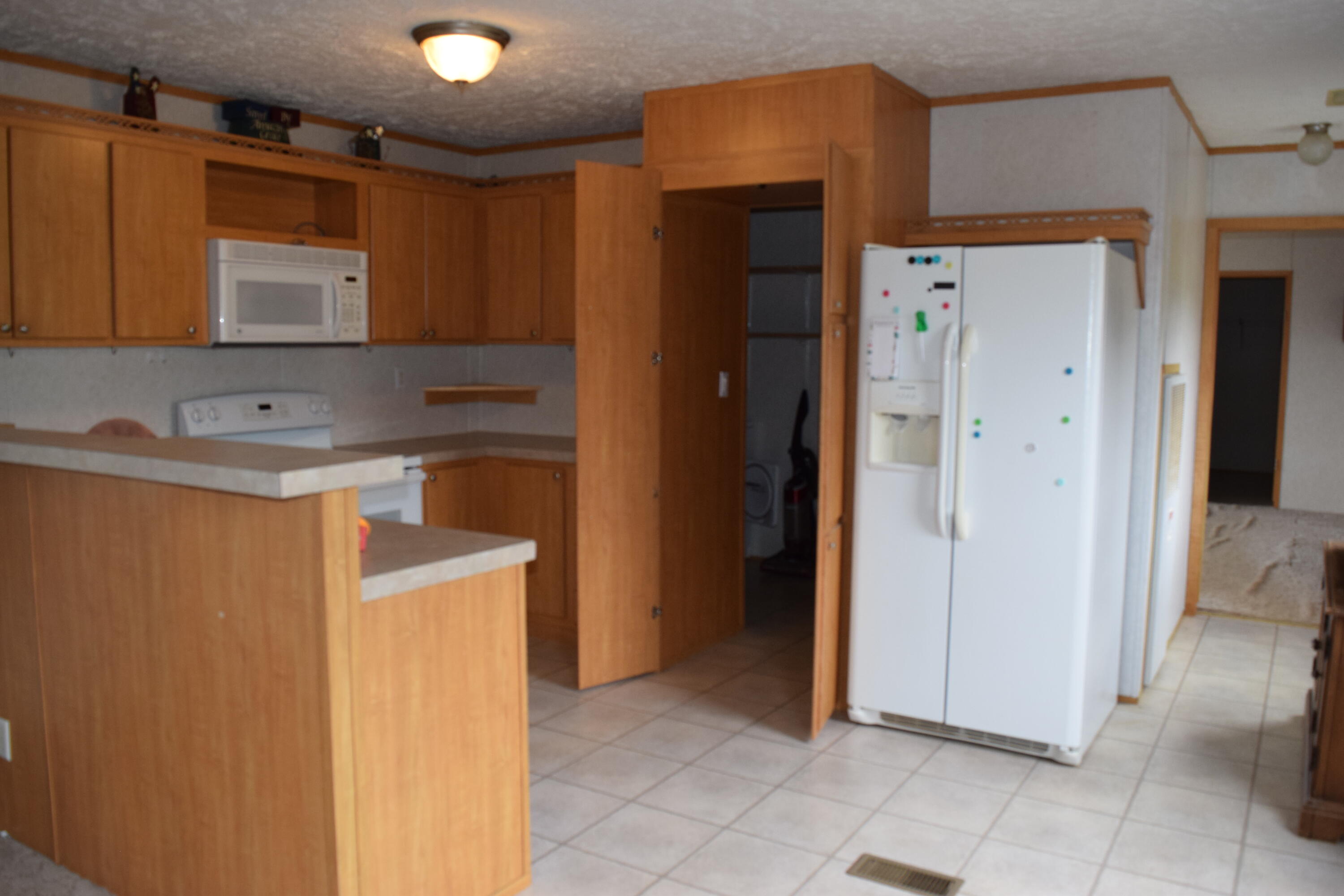 144 Weeks Road Northwest Floyd, VA 24091 - Photo 8 of 19 a utility room with cabinets washer and dryer