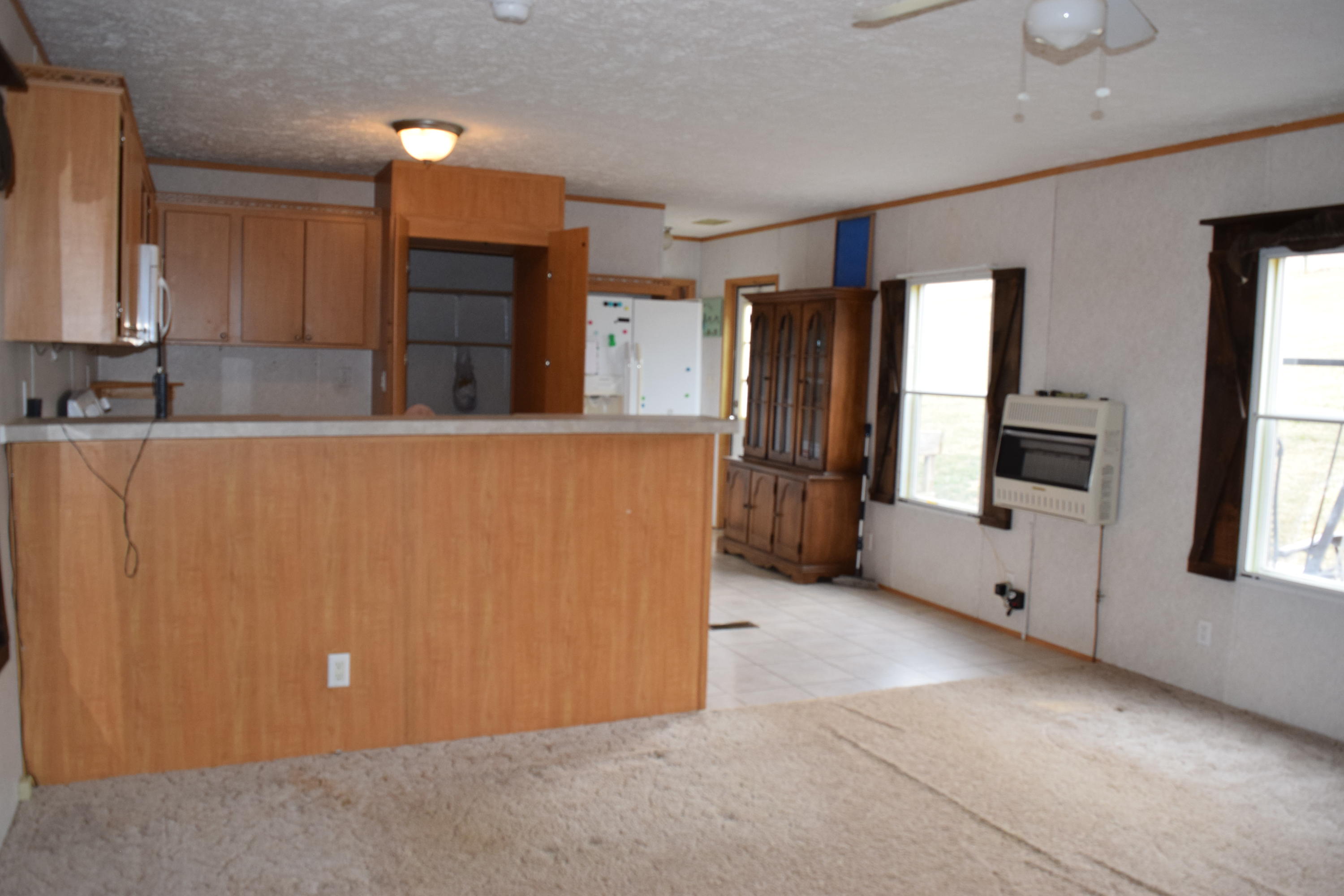 144 Weeks Road Northwest Floyd, VA 24091 - Photo 9 of 19 a view of kitchen with refrigerator and window