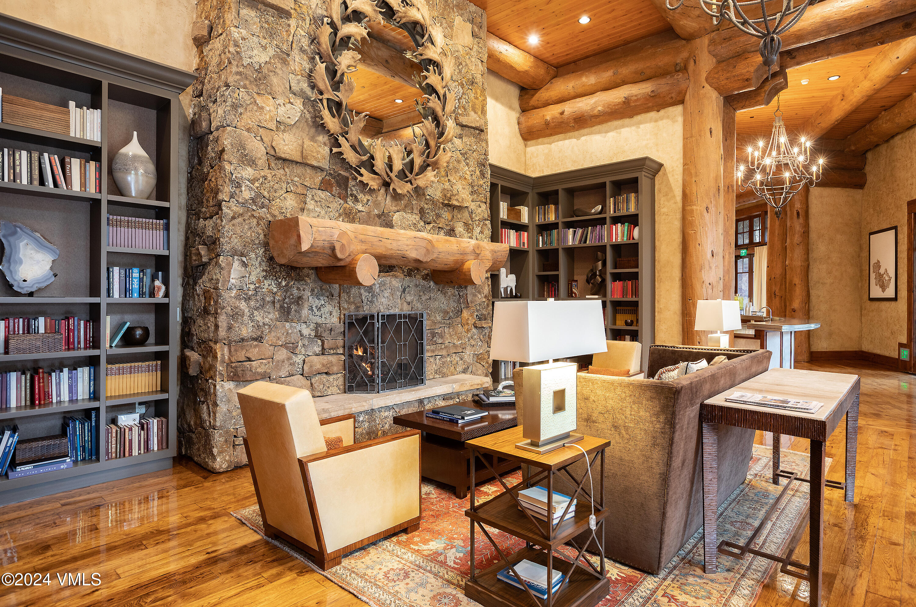 100 Bachelor Ridge Road, Unit 3208/4 Avon, CO 81620 - Photo 13 of 23 a living room with fireplace furniture and a book shelf