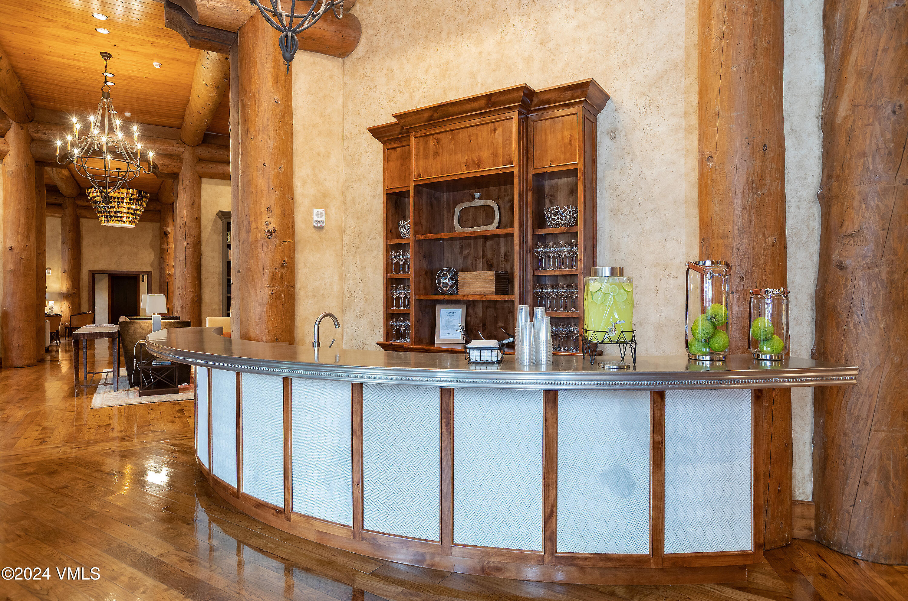 100 Bachelor Ridge Road, Unit 3208/4 Avon, CO 81620 - Photo 15 of 23 a view of a living room and kitchen with furniture and chandelier